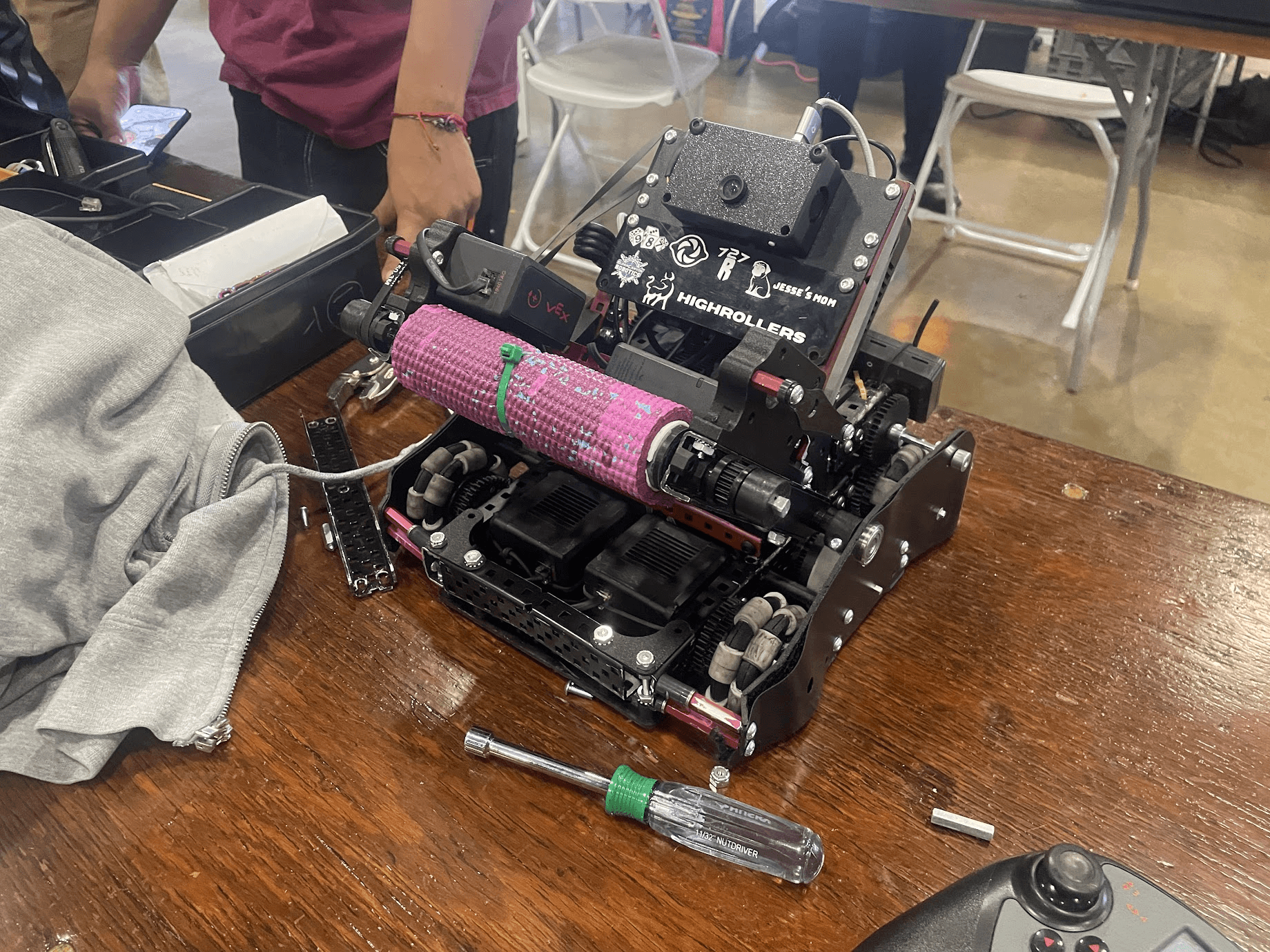 Robot at competition with pink roller